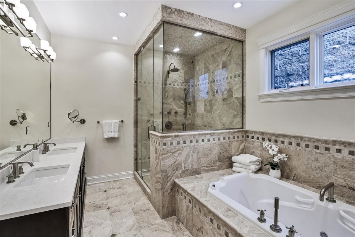 1445 West Wolfram Street Chicago, IL 60657 - Photo 31 of 69 a bathroom with a tub sink and mirror