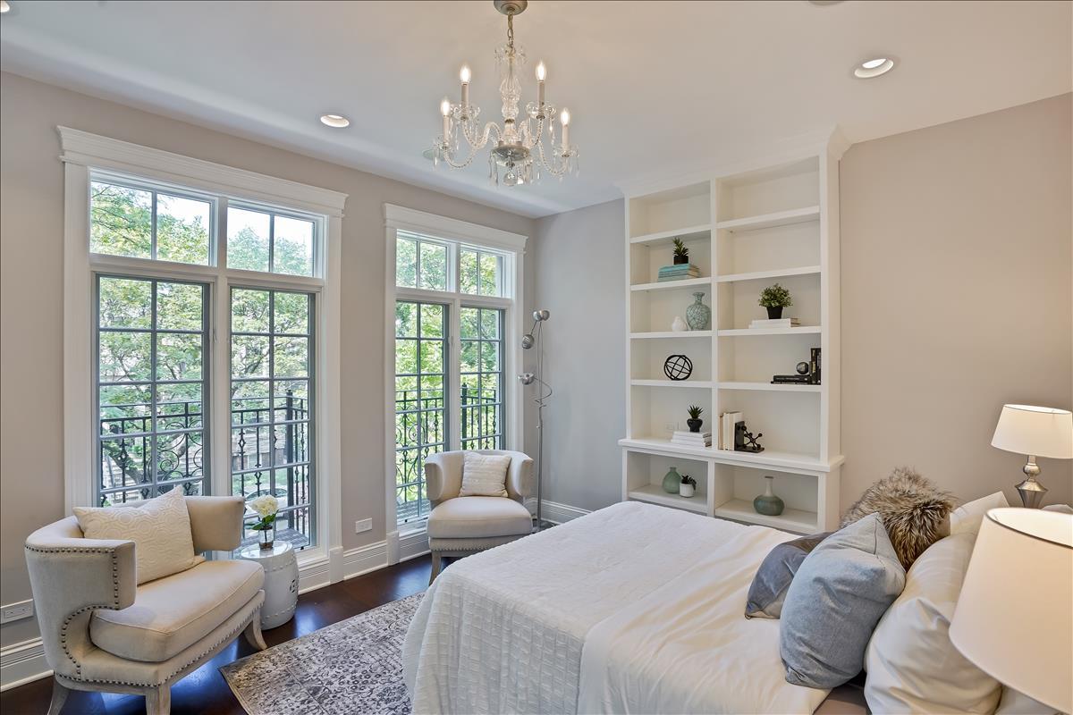 1445 West Wolfram Street Chicago, IL 60657 - Photo 34 of 69 a bedroom with a bed or couch and a large window