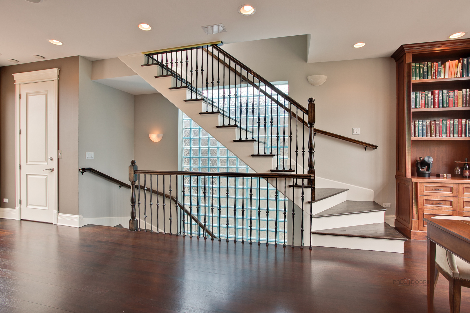 1445 West Wolfram Street Chicago, IL 60657 - Photo 38 of 69 a view of staircase with white walls and wooden floor