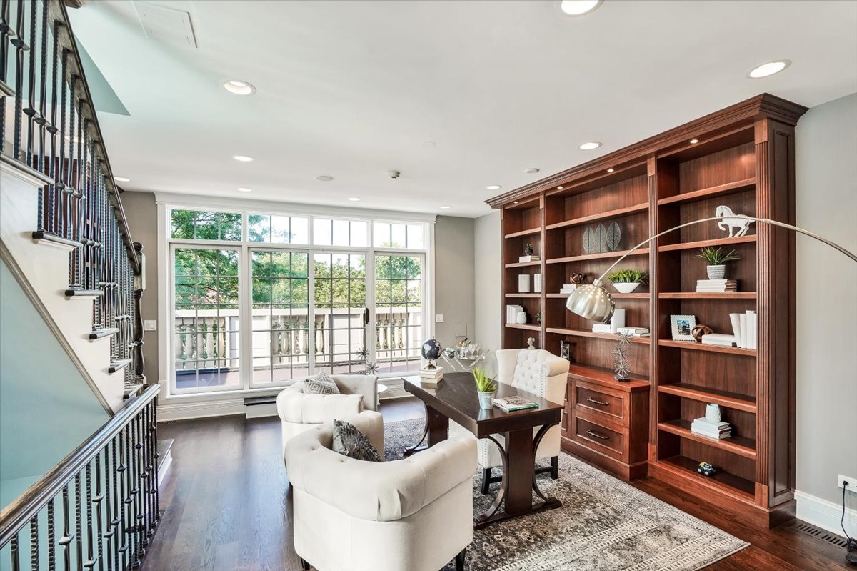 1445 West Wolfram Street Chicago, IL 60657 - Photo 39 of 69 a living room with furniture and a book shelf