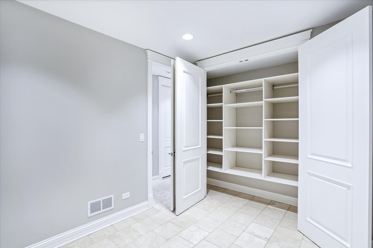 1445 West Wolfram Street Chicago, IL 60657 - Photo 58 of 69 a view of an empty room with a empty space and a window