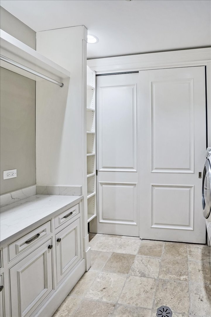 1445 West Wolfram Street Chicago, IL 60657 - Photo 63 of 69 a view of a kitchen with white cabinets and refrigerator
