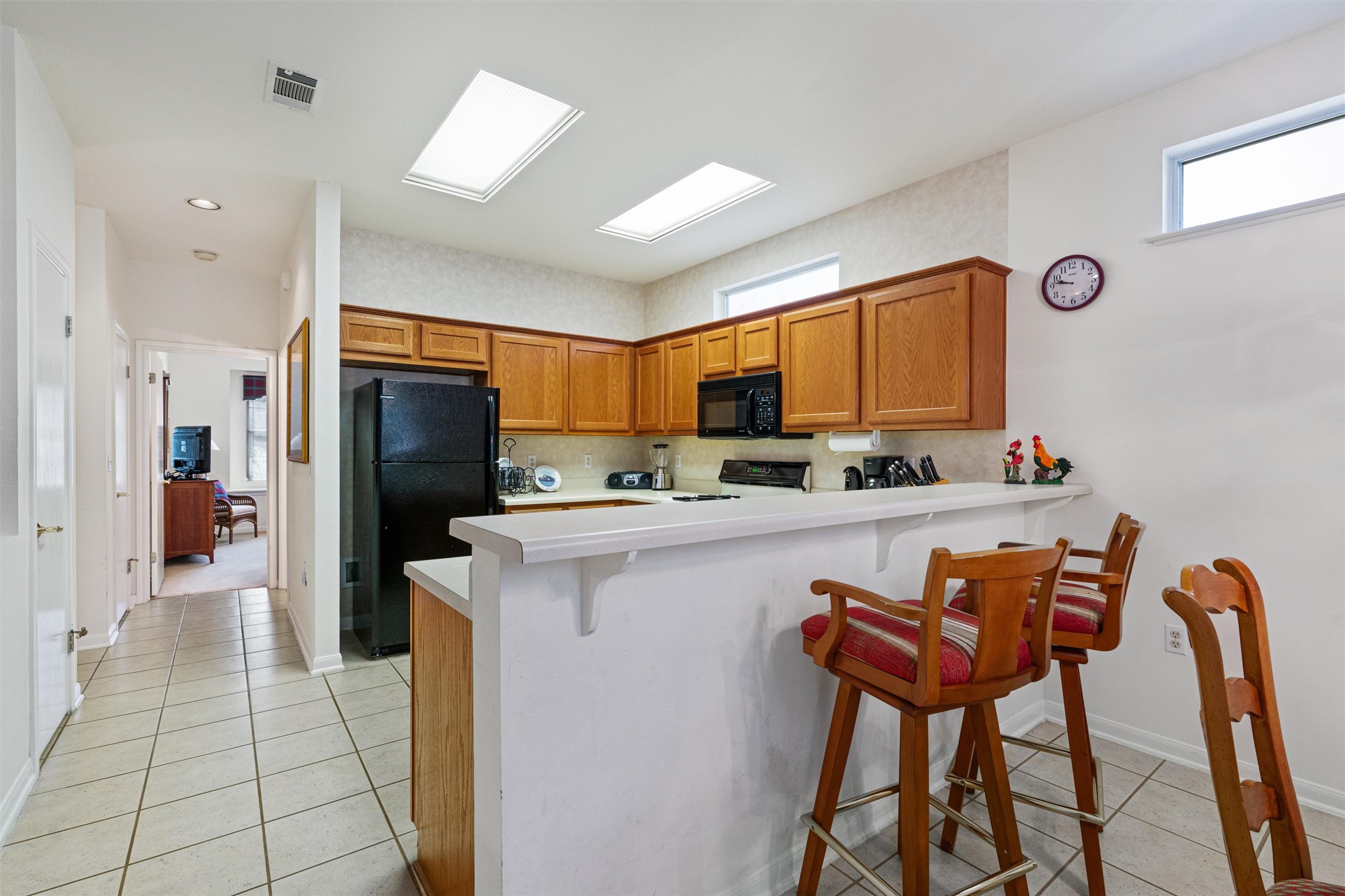 121 Larkspur Lane Georgetown, TX 78633 - Photo 11 of 28 a kitchen with stainless steel appliances a refrigerator and a stove top oven