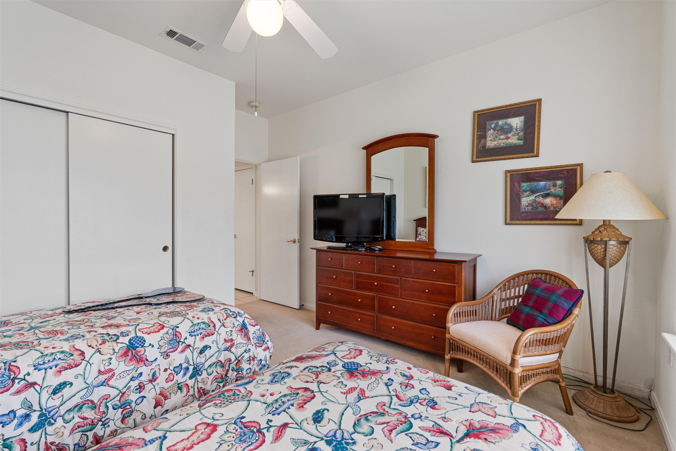 121 Larkspur Lane Georgetown, TX 78633 - Photo 17 of 28 a bedroom with a bed a couch and a chandelier