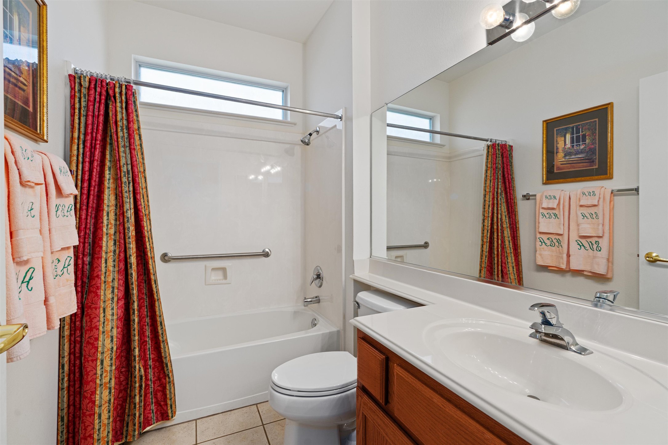 121 Larkspur Lane Georgetown, TX 78633 - Photo 18 of 28 a bathroom with a sink a toilet and a large mirror