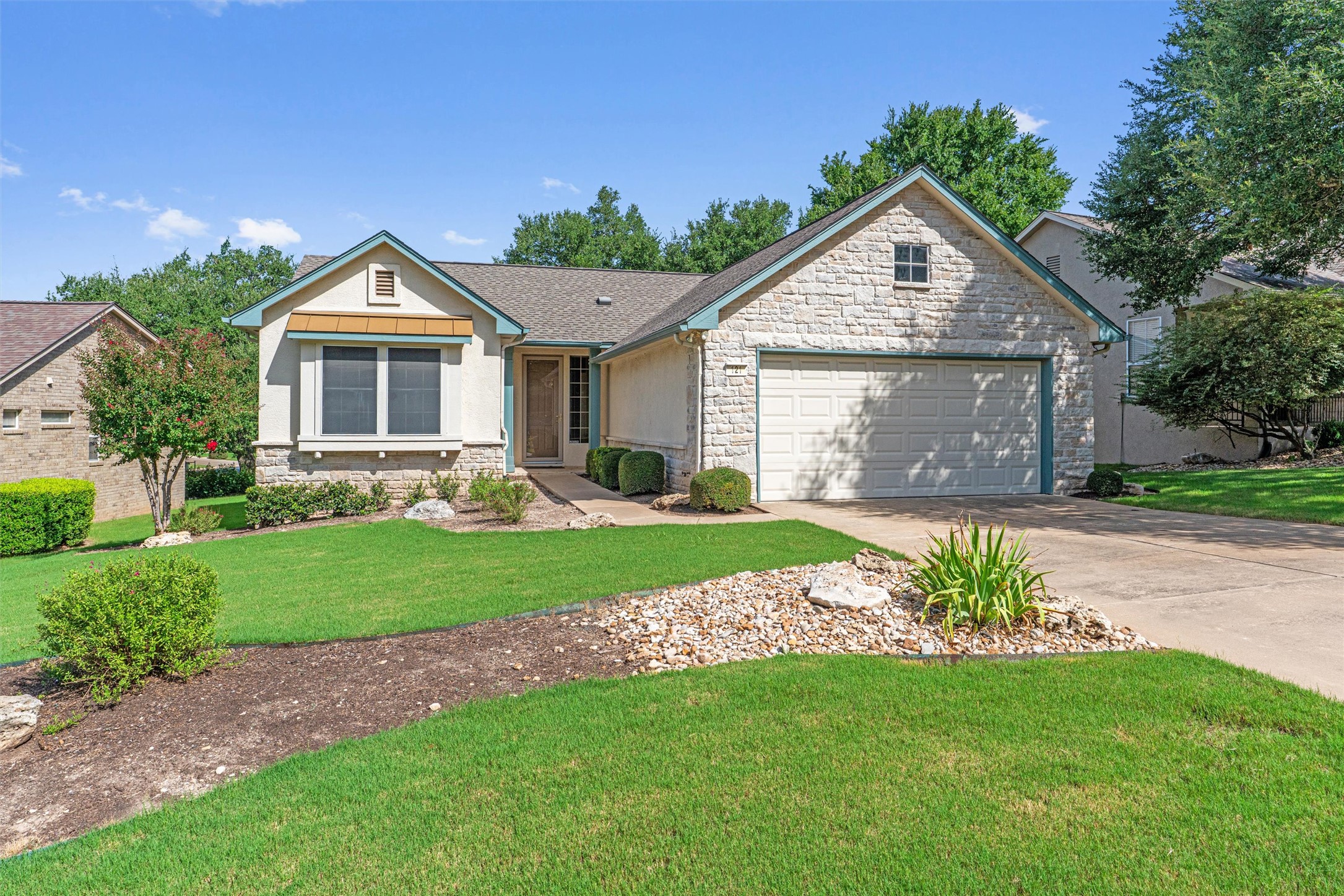 121 Larkspur Lane Georgetown, TX 78633 - Photo 2 of 28 a front view of a house with a garden