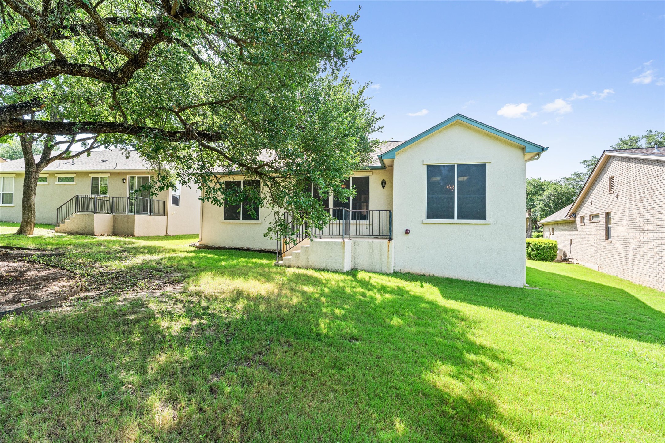 121 Larkspur Lane Georgetown, TX 78633 - Photo 23 of 28 a front view of a house with a yard and garage