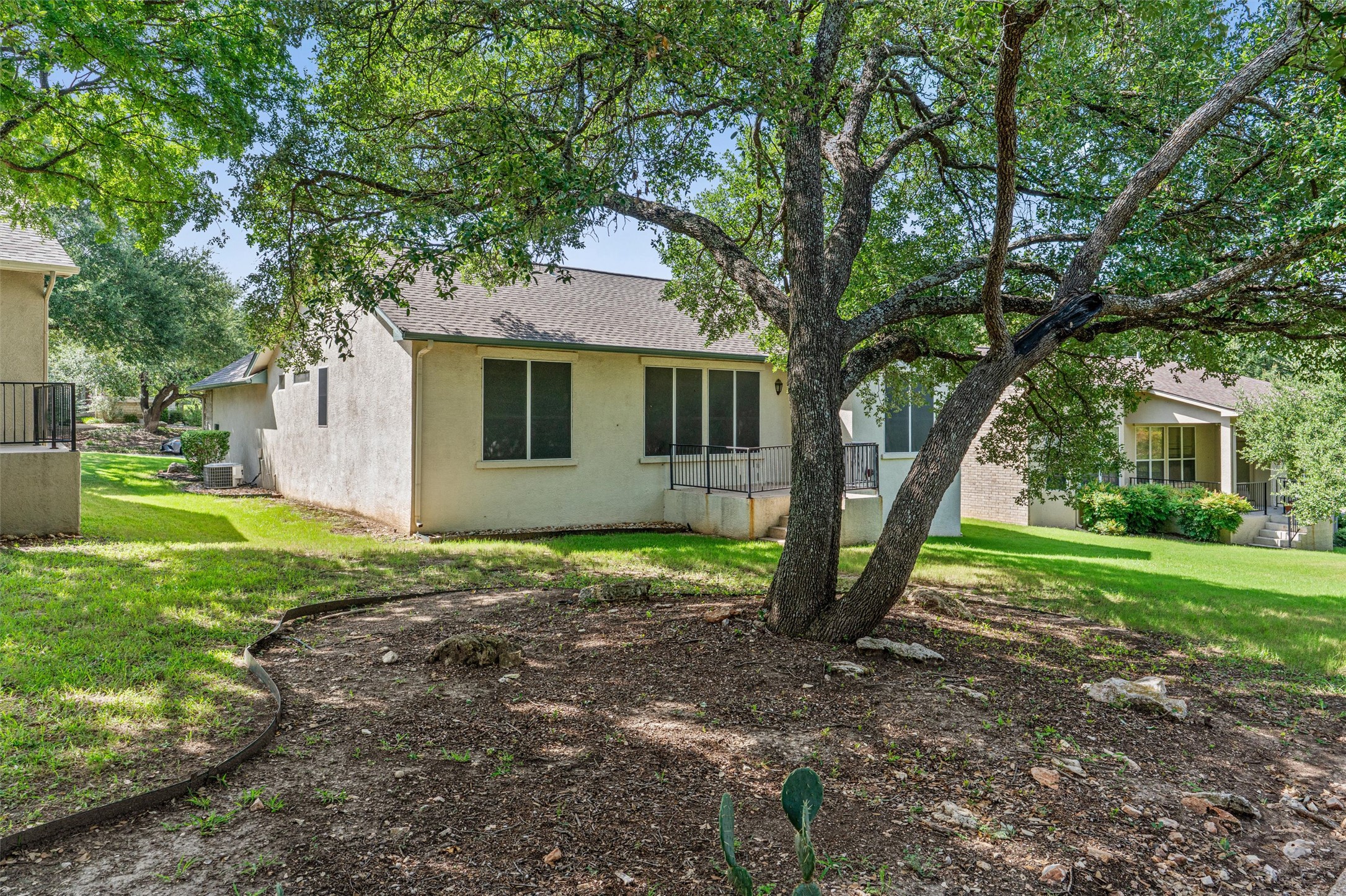 121 Larkspur Lane Georgetown, TX 78633 - Photo 25 of 28 a view of a house with backyard and a tree