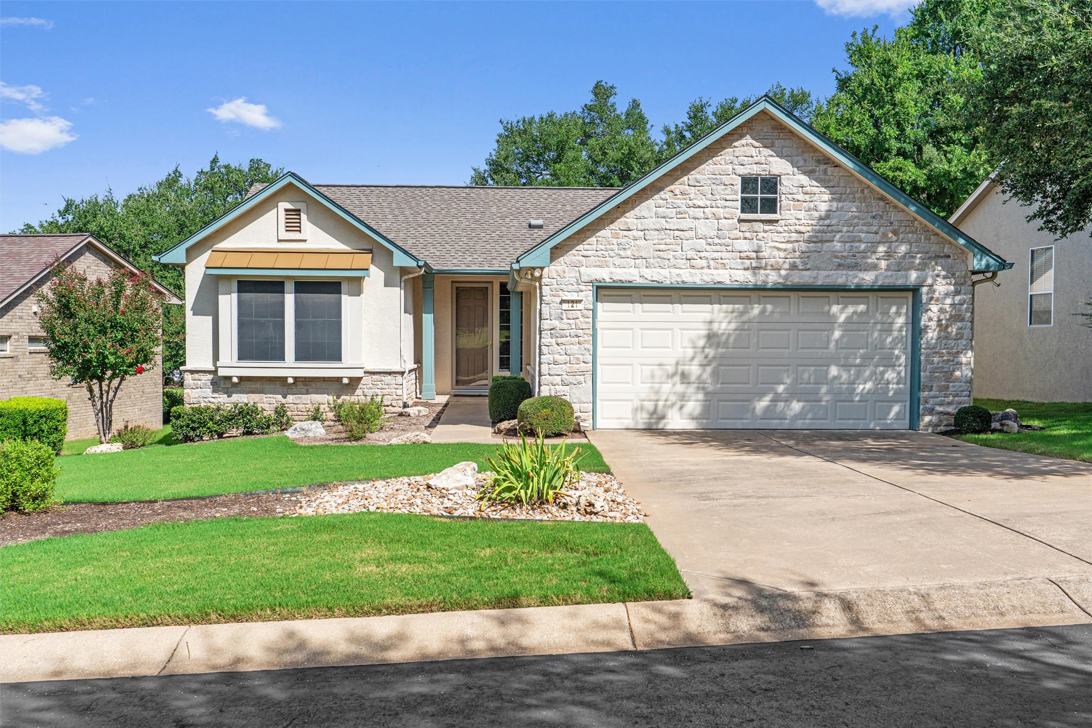 121 Larkspur Lane Georgetown, TX 78633 - Photo 3 of 28 a front view of a house with a yard and garage