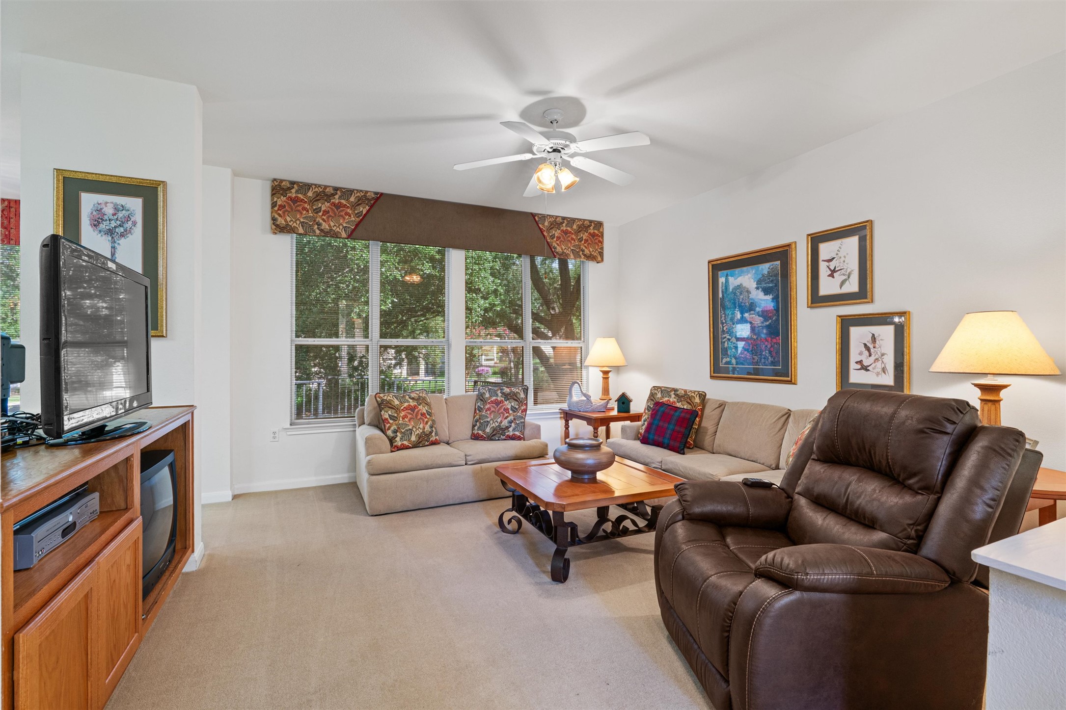 121 Larkspur Lane Georgetown, TX 78633 - Photo 6 of 28 a living room with furniture and a flat screen tv