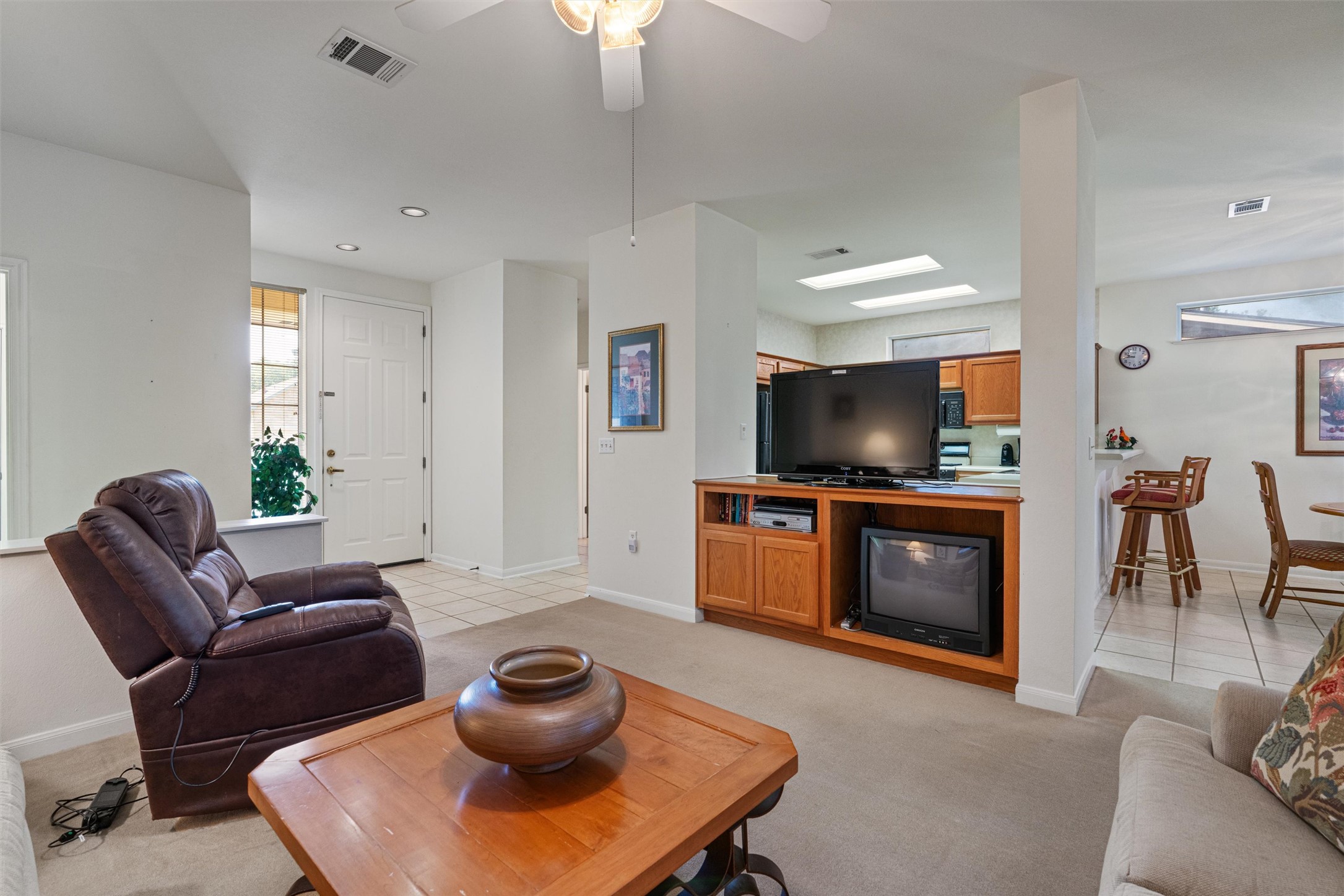 121 Larkspur Lane Georgetown, TX 78633 - Photo 7 of 28 a living room with furniture and a flat screen tv