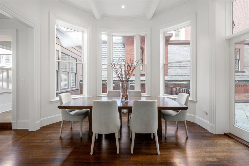 3 Commonwealth Avenue, Unit 1 Boston, MA 02116 - Photo 11 of 30 a view of a dining room with furniture and wooden floor
