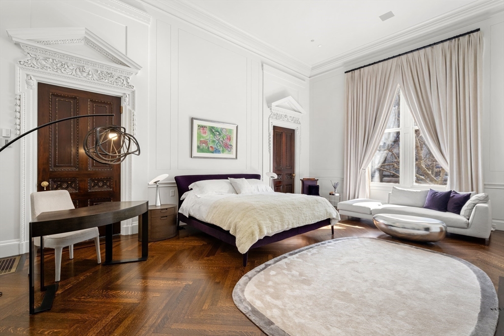 3 Commonwealth Avenue, Unit 1 Boston, MA 02116 - Photo 16 of 30 a spacious bedroom with two beds and a window