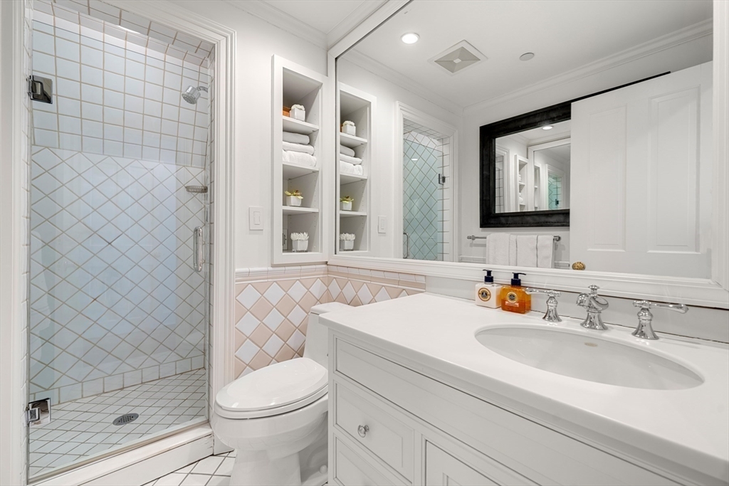 3 Commonwealth Avenue, Unit 1 Boston, MA 02116 - Photo 20 of 30 a bathroom with a sink toilet and shower