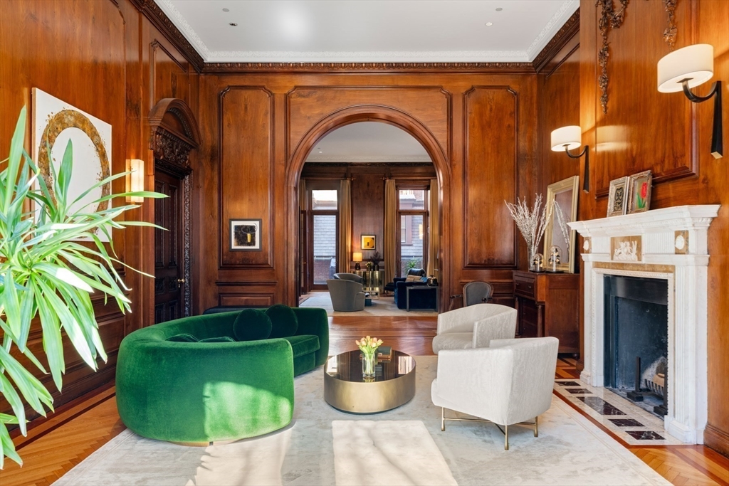 3 Commonwealth Avenue, Unit 1 Boston, MA 02116 - Photo 2 of 30 a living room with fireplace furniture and a potted plant