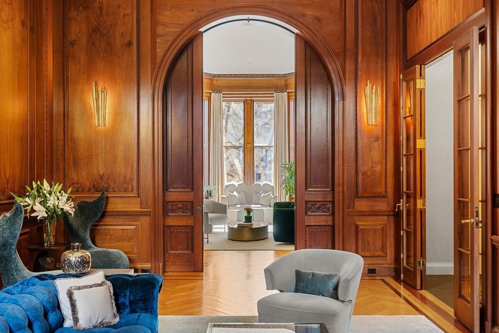3 Commonwealth Avenue, Unit 1 Boston, MA 02116 - Photo 3 of 30 a living room with furniture and a potted plant