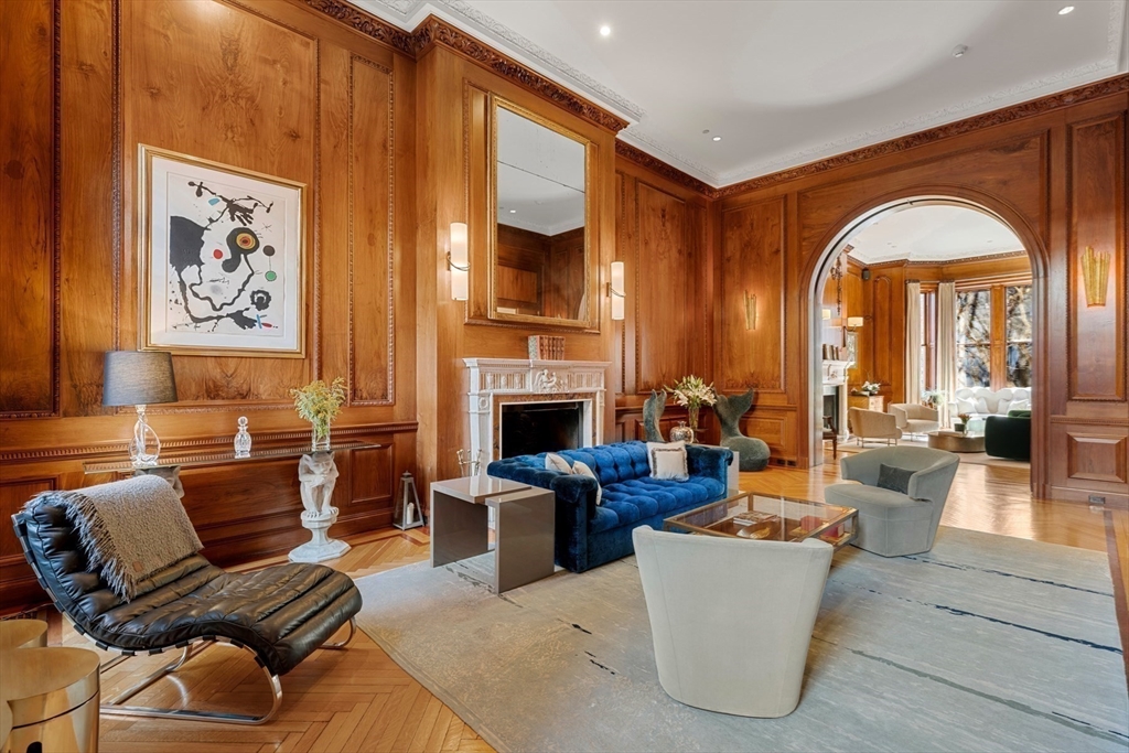 3 Commonwealth Avenue, Unit 1 Boston, MA 02116 - Photo 5 of 30 a living room with fireplace furniture and a large window