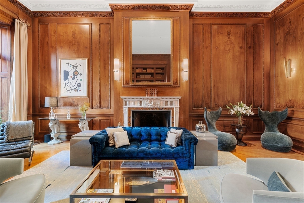 3 Commonwealth Avenue, Unit 1 Boston, MA 02116 - Photo 6 of 30 a living room with furniture and a fireplace