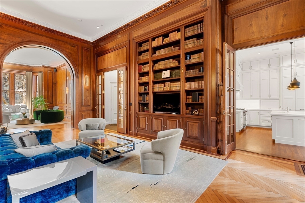 3 Commonwealth Avenue, Unit 1 Boston, MA 02116 - Photo 7 of 30 a living room with furniture a fireplace and a potted plant