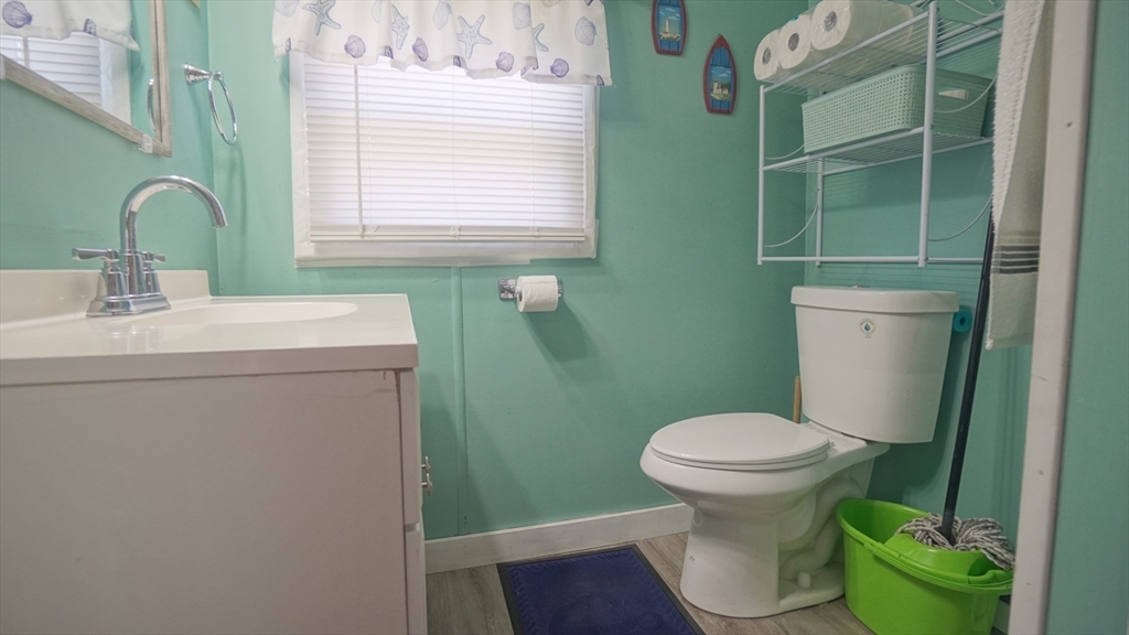 93 Grochmal Avenue, Unit 126 Springfield, MA 01151 - Photo 30 of 35 a bathroom with sink toilet and a window