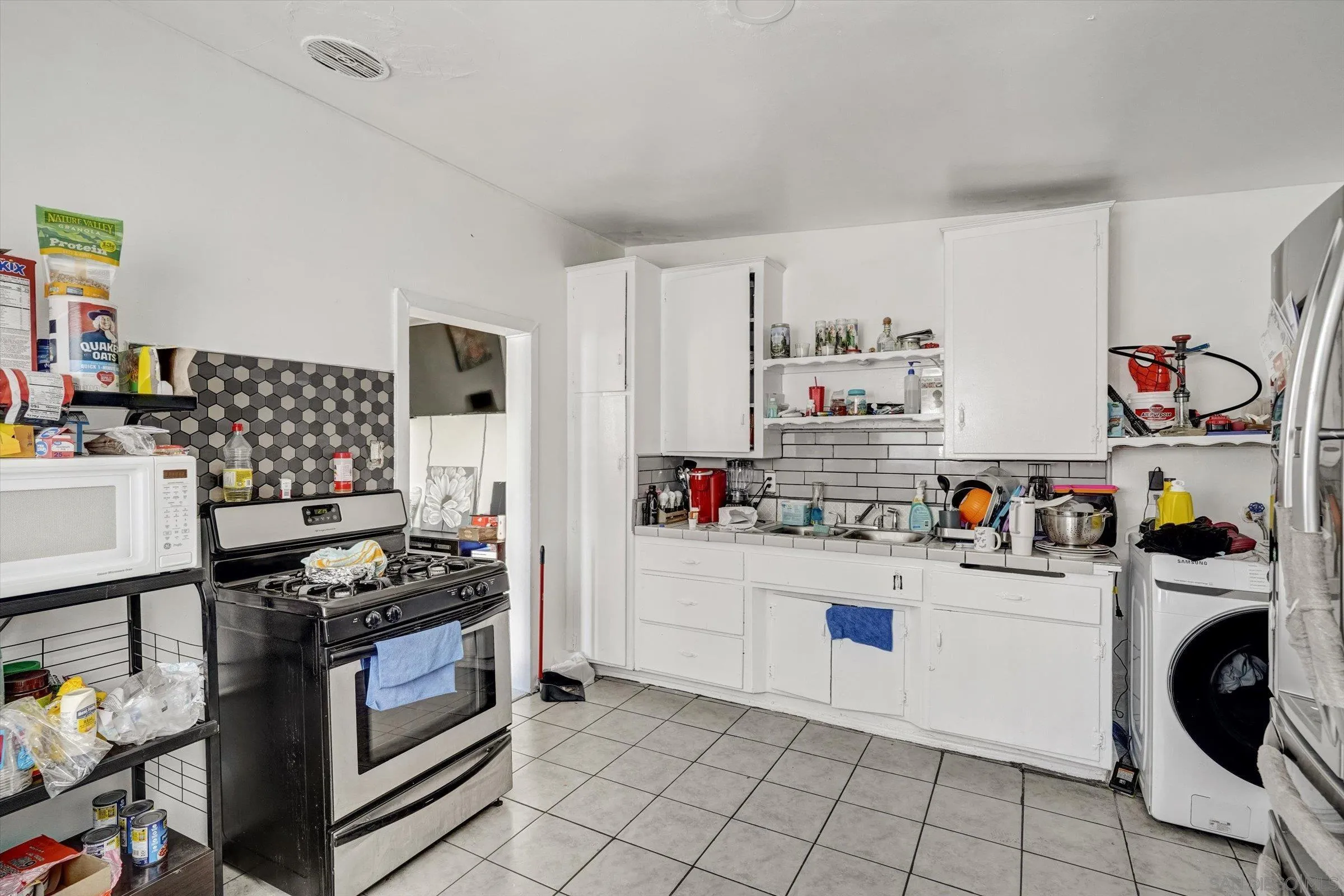 10260 Cook Avenue Riverside, CA 92503 - Photo 22 of 32 a kitchen with refrigerator and cabinets