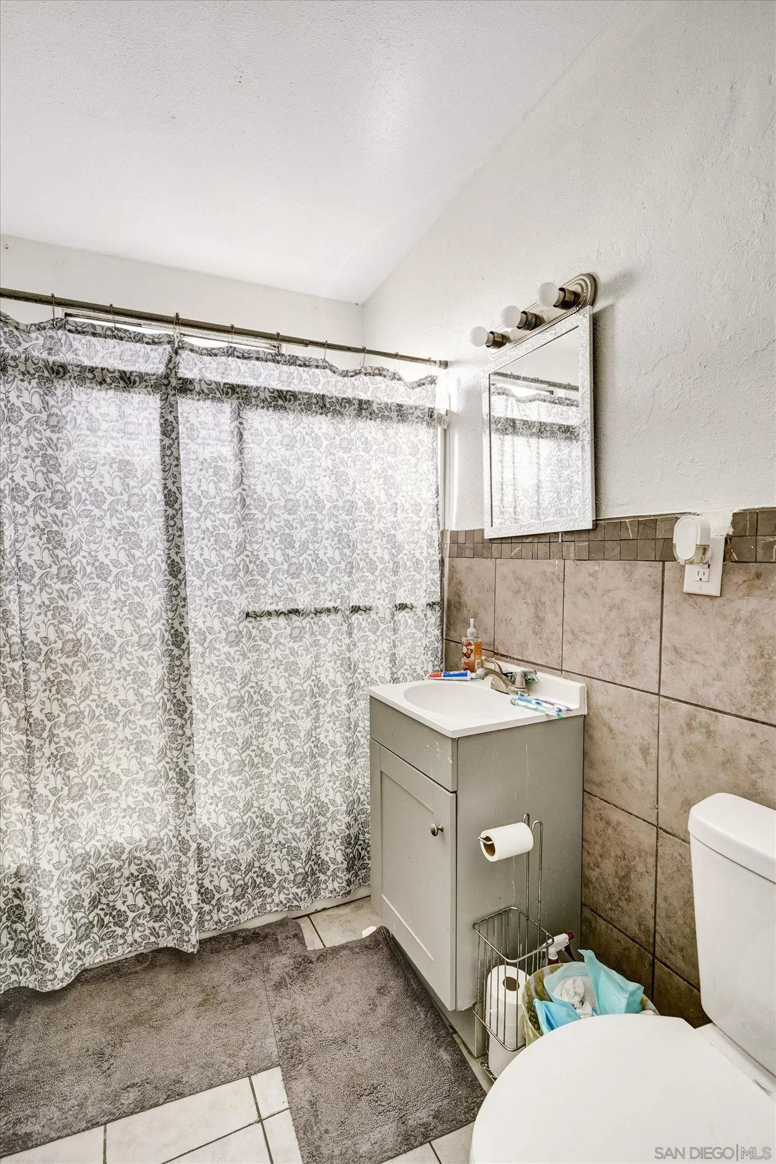 10260 Cook Avenue Riverside, CA 92503 - Photo 23 of 32 a bathroom with a granite countertop sink toilet and shower