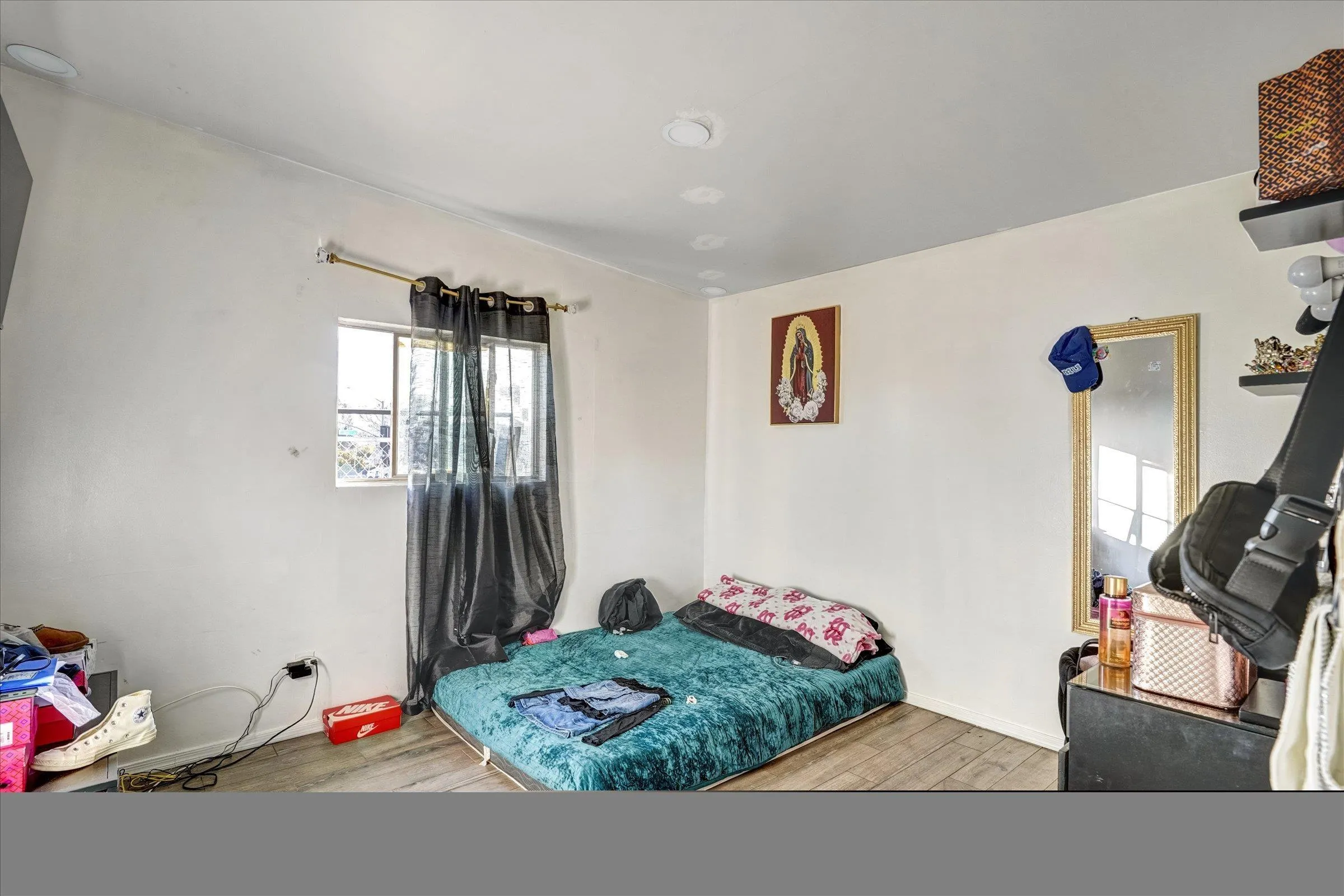 10260 Cook Avenue Riverside, CA 92503 - Photo 24 of 32 a bedroom with furniture and a wooden floor