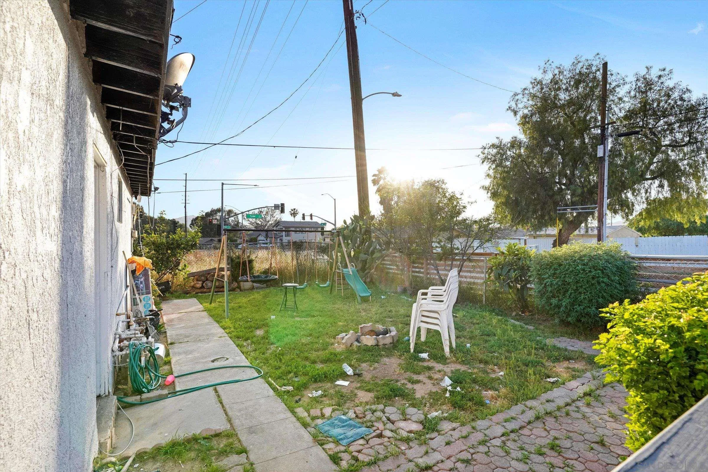 10260 Cook Avenue Riverside, CA 92503 - Photo 32 of 32 a backyard of a house with fountain table and chairs