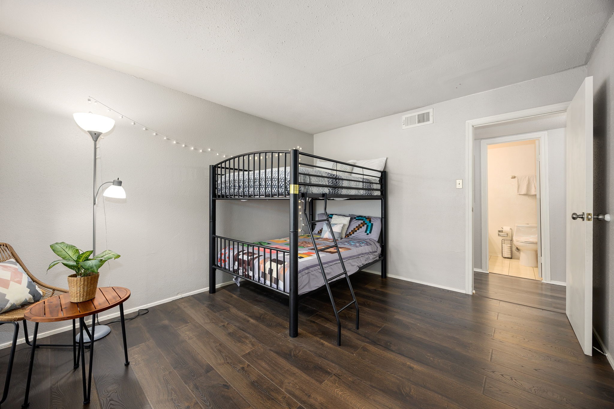 7950 North Stadium Drive, Unit 232 Houston, TX 77030 - Photo 9 of 21 a bedroom with furniture and wooden floor