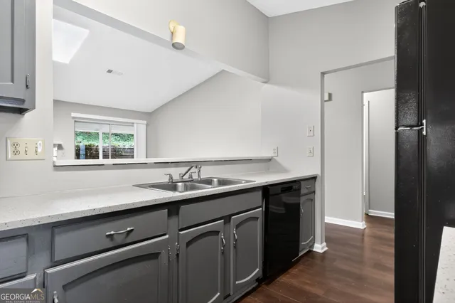a kitchen with a sink and a window