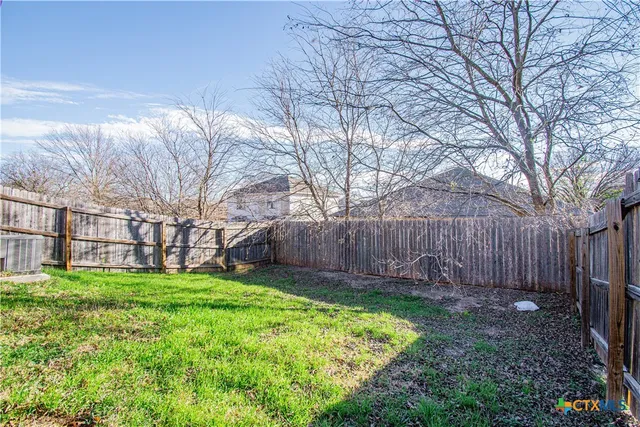 a view of a backyard with a small cabin