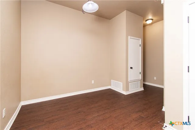 a view of a livingroom with wooden floor