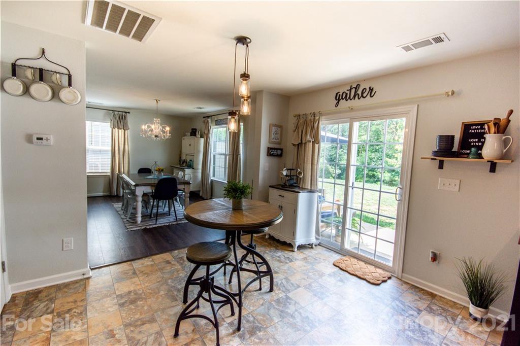 129 Mossy Pond Road Statesville, NC 28677 - Photo 14 of 47 a view of a livingroom with furniture window and wooden floor