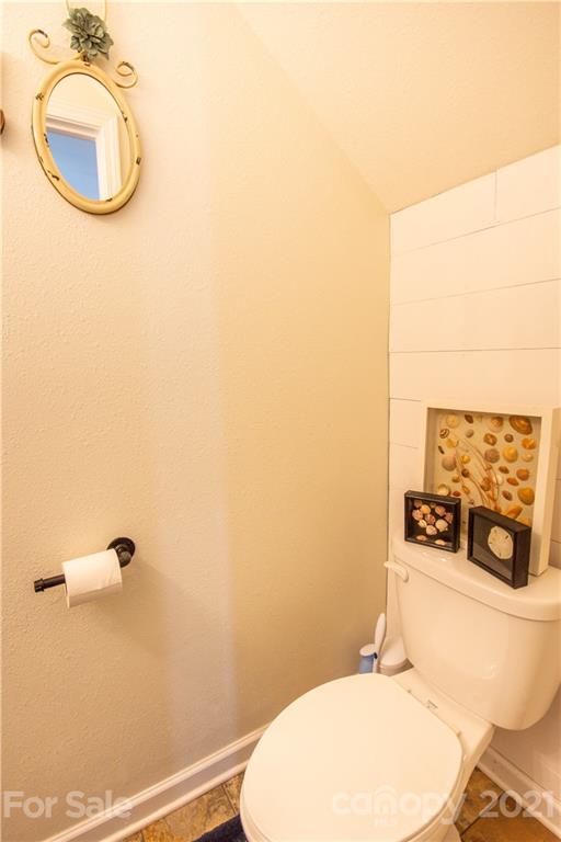 129 Mossy Pond Road Statesville, NC 28677 - Photo 22 of 47 a bathroom with a sink mirror vanity and toilet
