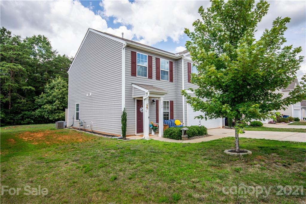 129 Mossy Pond Road Statesville, NC 28677 - Photo 4 of 47 a front view of a house with a yard