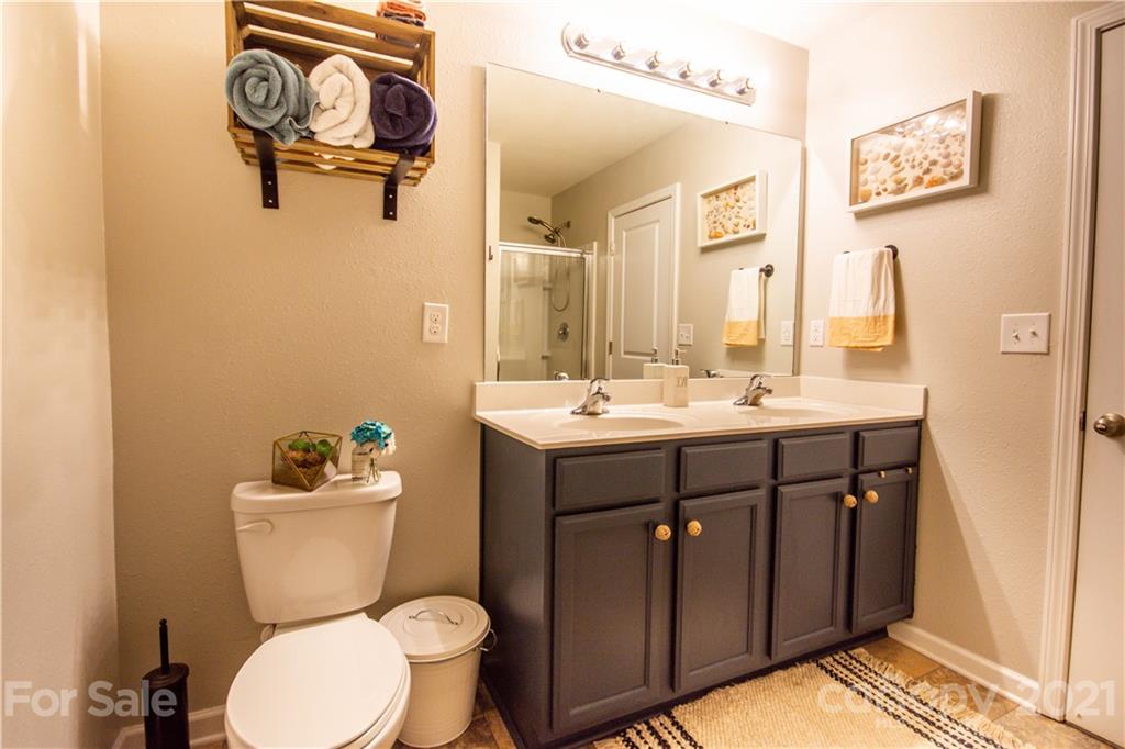 129 Mossy Pond Road Statesville, NC 28677 - Photo 31 of 47 a bathroom with a sink mirror vanity and toilet