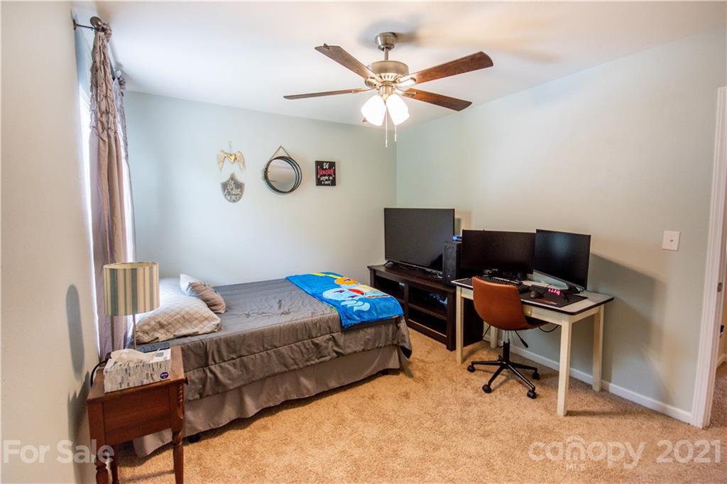 129 Mossy Pond Road Statesville, NC 28677 - Photo 33 of 47 a bedroom with furniture and a window