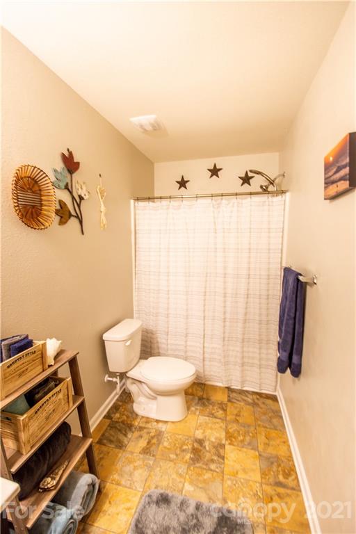 129 Mossy Pond Road Statesville, NC 28677 - Photo 38 of 47 a bathroom with a sink and a shower