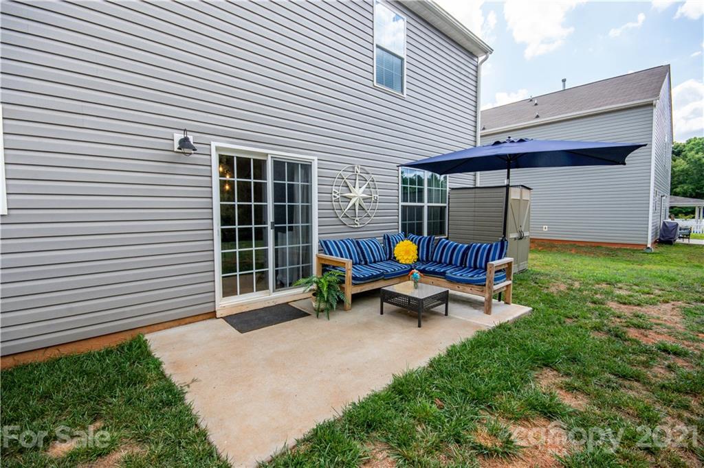 129 Mossy Pond Road Statesville, NC 28677 - Photo 39 of 47 a view of a lounge chair in the back yard of the house