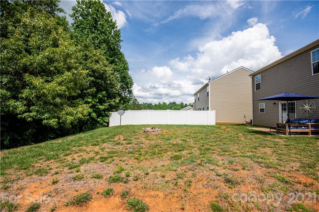 129 Mossy Pond Road Statesville, NC 28677 - Photo 44 of 47 a view of a house with a yard