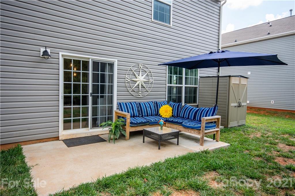 129 Mossy Pond Road Statesville, NC 28677 - Photo 45 of 47 a view of a two chairs in the back yard