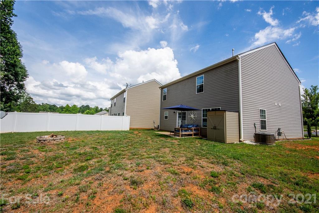 129 Mossy Pond Road Statesville, NC 28677 - Photo 46 of 47 a view of a house with a yard