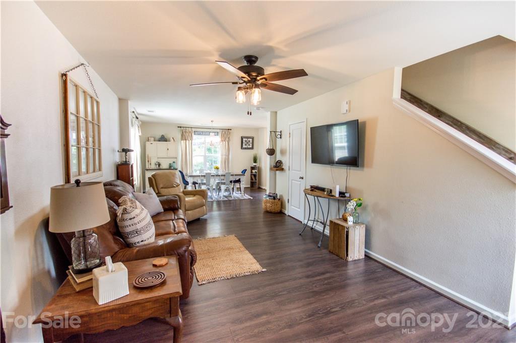 129 Mossy Pond Road Statesville, NC 28677 - Photo 7 of 47 a living room with furniture a flat screen tv and a wooden floor