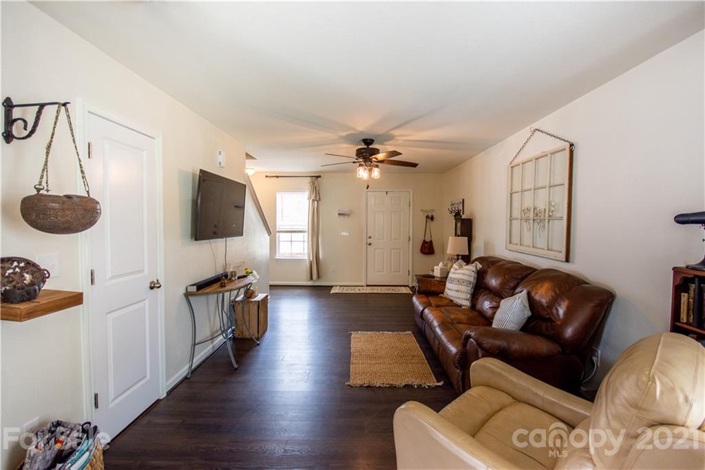 129 Mossy Pond Road Statesville, NC 28677 - Photo 8 of 47 a living room with furniture and a flat screen tv