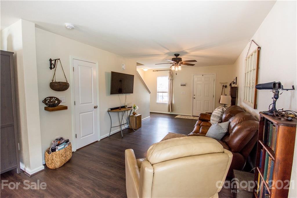 129 Mossy Pond Road Statesville, NC 28677 - Photo 10 of 47 a living room with furniture and a flat screen tv