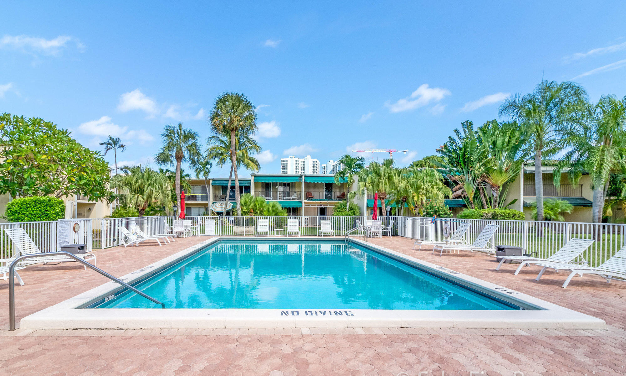390 Golfview Road, Unit G North Palm Beach, FL 33408 - Photo 28 of 36 a view of a swimming pool with a patio