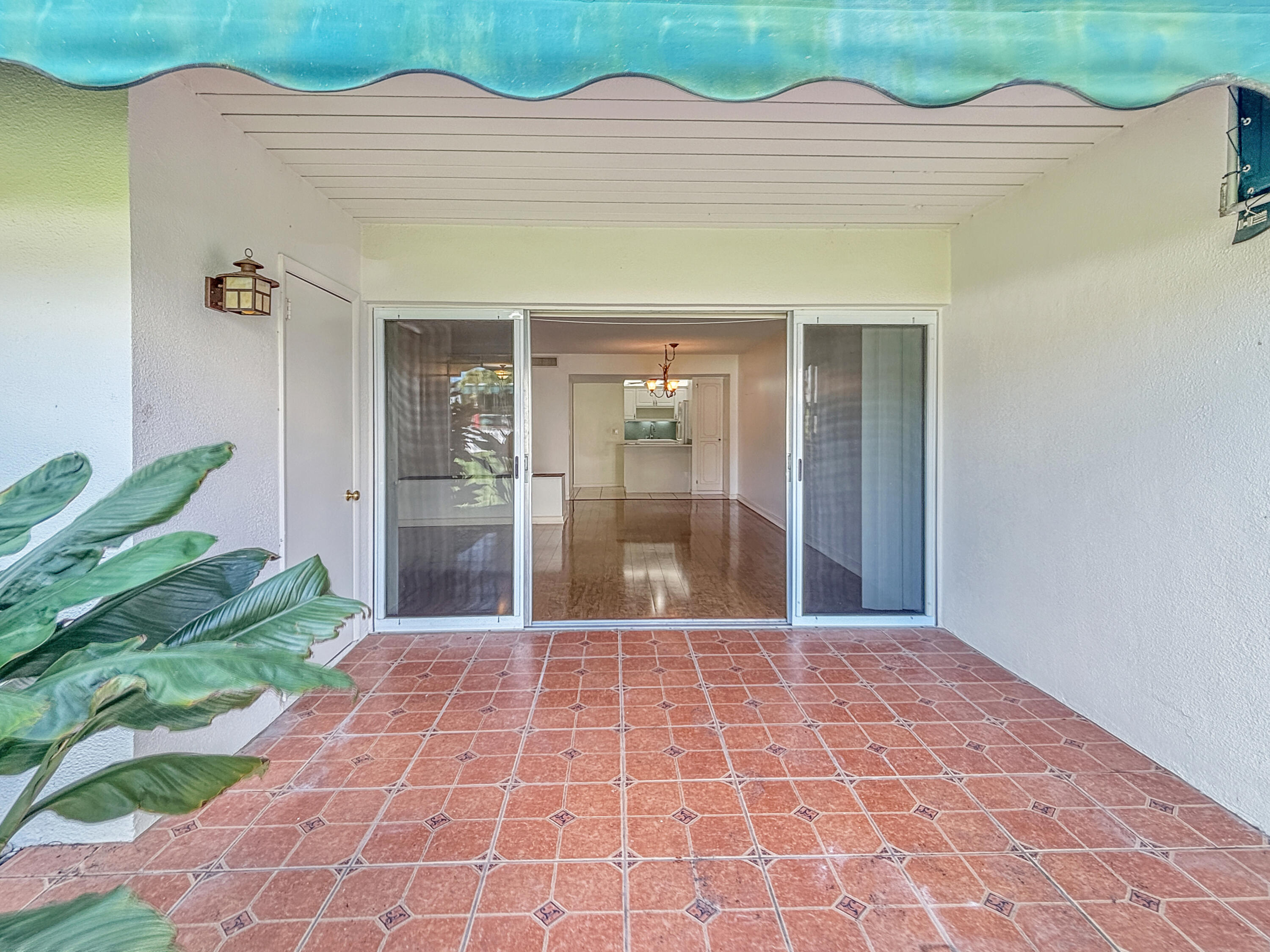390 Golfview Road, Unit G North Palm Beach, FL 33408 - Photo 9 of 36 a view of a white house with a outdoor space
