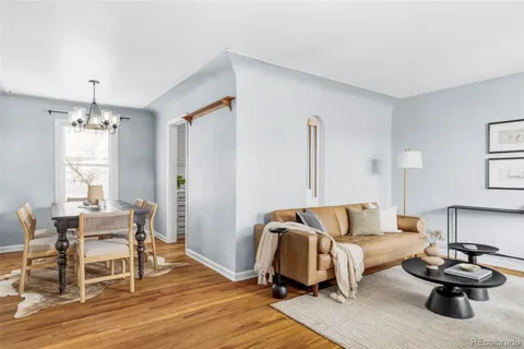 a bedroom with furniture and wooden floor
