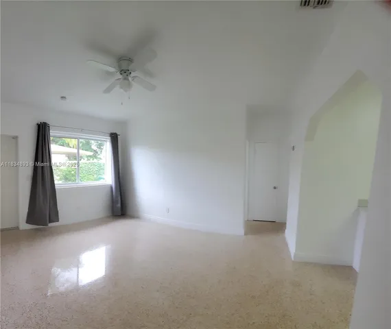 a view of an empty room with a window