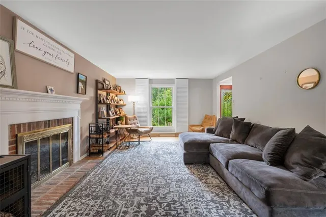 a living room with furniture window and a fireplace